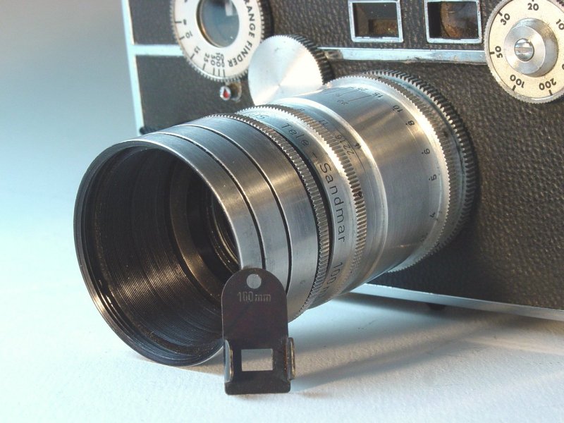 Viewfinder mask device leaning against Argus Tele-Sandmar 100mm f/4.5 installed on C3