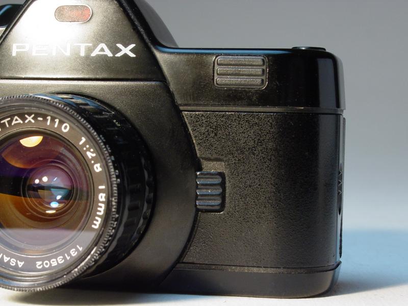 Pentax A110 Super with Pentax-110 18mm f/2.8 - Exposure Adjustment Button - Click to Enlarge